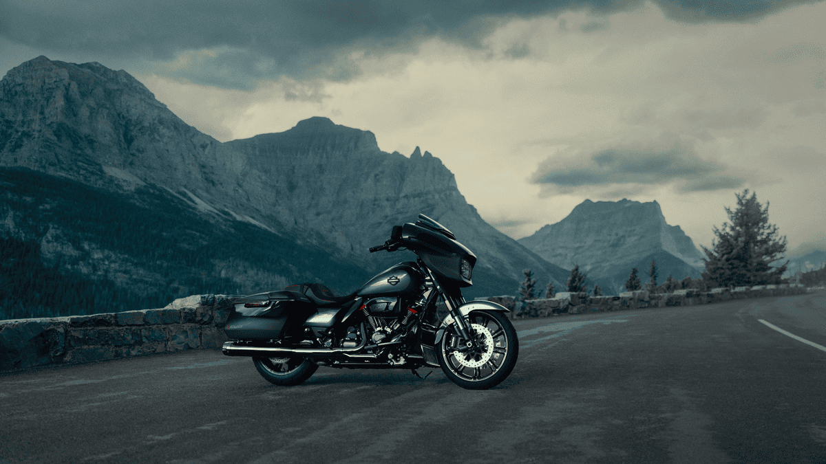 2025 Harley-Davidson® CVO™ Street Glide® parked along a mountain road near Sanford, FL with dramatic peaks in the background